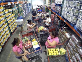 Shoppers wait in line for the arrival of a shipment of water during preparations for the impending arrival of Hurricane Irma, Wednesday, Sept. 6, 2017 in Altamonte Springs, Fla.  Irma roared into the Caribbean with record force early Wednesday, its 185-mph winds shaking homes and flooding buildings on a chain of small islands along a path toward Puerto Rico, Cuba and Hispaniola and a possible direct hit on densely populated South Florida.  (Joe Burbank/Orlando Sentinel via AP)