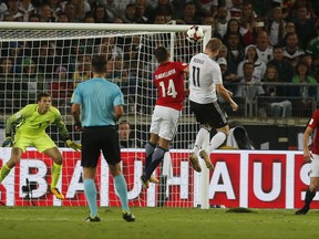 Germany's Timo Werner, center, scores his side's fourth goal during the World Cup Group C qualifying soccer match between Germany and Norway in Stuttgart, Germany, Monday, Sept. 4, 2017. (AP Photo/Michael Probst)