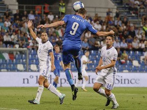 Italy's Andrea Belotti heads the ball during the World Cup Group G qualifying soccer match between Italy and Israel at the Mapei Stadium in Reggio Emilia, Italy, Tuesday, Sept. 5, 2017. (AP Photo/Luca Bruno)