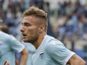 Lazio's Ciro Immobile celebrates after scoring during a Serie A soccer match between Lazio and AC Milan, at the Rome Olympic stadium, Sunday, Sept. 10, 2017. (AP Photo/Alessandra Tarantino)