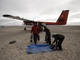 Underwater Archeologists and Guardians load supplies on a plane leaveing Davit camp on Saunitalik Island near Gjoa Haven Nunavutin Gjoa Haven Nunavut, on Friday September 1, 2017.