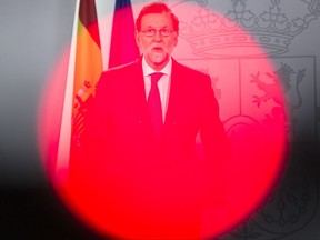Spain's Prime Minister Mariano Rajoy gives a speech following an urgent cabinet meeting at the Moncloa palace in Madrid, Thursday, Sept. 7, 2017. Rajoy said Spain's government is asking the country's constitutional court to suspend a bid by leaders in Catalonia to hold a referendum on independence from Spain on Oct. 1. (AP Photo/Francisco Seco)