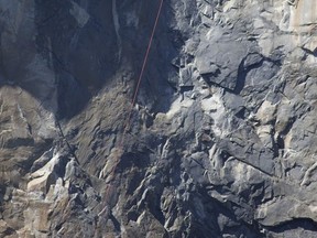 A helicopter makes a rescue off El Capitan after a major rock fall in Yosemite National Park, Calif.