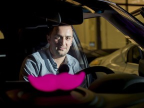 FILE - In this Jan. 26, 2015, file photo, Lyft co-founder John Zimmer displays his company's "glowstache" following a launch event in San Francisco. When management upheaval, allegations of corporate espionage, and revelations of sexual harassment sent Uber into a public relations sinkhole, its long overshadowed rival Lyft shifted into overdrive. The company seized the opportunity to recruit disillusioned drivers so it could be more responsive to passengers searching for a ride-hailing alternative to Uber. After five years of being content in its role as the underdog of ride hailing, Lyft is proving to be a more imposing threat to Uber. (AP Photo/Noah Berger, File)