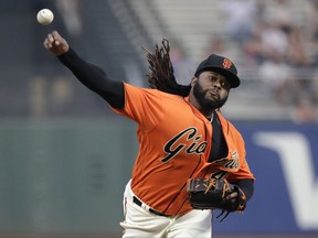 San Francisco Giants starting pitcher Johnny Cueto throws to the St. Louis Cardinals during the first inning of a baseball game Friday, Sept. 1, 2017, in San Francisco. (AP Photo/Marcio Jose Sanchez)