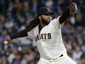 San Francisco Giants pitcher Johnny Cueto throws against the Colorado Rockies during the first inning of a baseball game in San Francisco, Tuesday, Sept. 19, 2017. (AP Photo/Jeff Chiu)