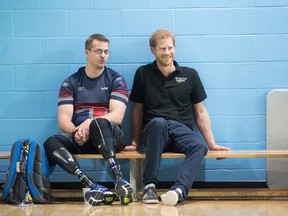 Prince Harry attends Invictus Games training at the Toronto Pan Am Sports Centre, in Toronto on Sept. 22 2017, with an unidentified athlete.