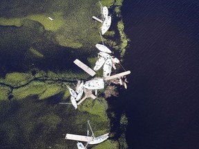 Boats blown away from their docks sit in the marsh after Hurricane Irma on Tuesday, Sept. 12, 2017, at St. Marys on the Georgia coast. (Curtis Compton/Atlanta Journal-Constitution via AP)