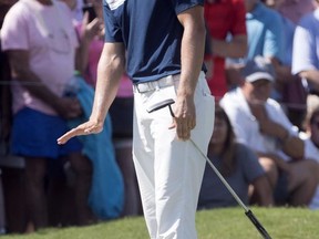 Jordan Spieth reacts to his putt on the first green during the final round of the Tour Championship golf tournament at East Lake Golf Club in Atlanta, Sunday, Sept. 24, 2017, in Atlanta. (AP Photo/John Amis)