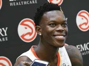 Guard Dennis Schroder of Germany takes questions during the Atlanta Hawks basketball media day, Monday, Sept. 25, 2017, in Atlanta. (AP Photo/John Amis)