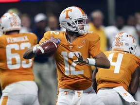 Tennessee quarterback Quinten Dormady (12) throws from the pocket in the first half of an NCAA college football game against the Georgia Tech, Monday, Sept. 4, 2017, in Atlanta. (AP Photo/John Bazemore)