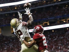 Florida State wide receiver Auden Tate (18) makes a touchdown catch against Alabama defensive back Minkah Fitzpatrick (29) during the first half of an NCAA football game, Saturday, Sept. 2, 2017, in Atlanta. (AP Photo/John Bazemore)