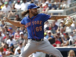 New York Mets starting pitcher Robert Gsellman throws in the first inning of a baseball game against the Atlanta Braves in Atlanta, Sunday, Sept. 17, 2017. (AP Photo/Tami Chappell)