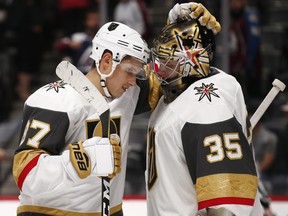 Las Vegas Golden Knights centre Vadim Shipachyov (left) and goalie Oscar Dansk celebrate a 4-1 victory over the Colorado Avalanche on Sept. 19.