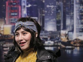 Hong Kong actress and singer Josie Ho smiles during an interview in Hong Kong, Tuesday, Sept. 12, 2017. The daughter of the Macau Casino Mogul Stanley Ho, Ho is putting out new music, touring Asia, and shot a new travel segment on TLC. (AP Photo/Vincent Yu)