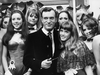 Hugh Hefner at the Playboy Club in London in 1969. He is with his 19-year-old girlfriend Barbara Benton and a group of Playboy Bunnies.