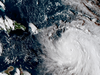 A satellite image provided shows the eye of Hurricane Maria as it nears Dominica on Monday,  Sept. 18. The National Hurricane Center in Miami said Monday evening that Maria had strengthened into a storm with 160 mph winds.