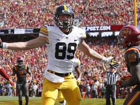 Iowa wide receiver Matt VandeBerg (89) celebrates in front of Iowa State defensive back Brian Peavy (10) after catching a 17-yard touchdown pass during the first half of an NCAA college football game, Saturday, Sept. 9, 2017, in Ames, Iowa. (AP Photo/Charlie Neibergall)