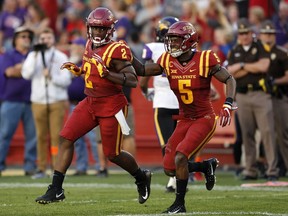 Iowa State linebacker Willie Harvey (2) celebrates with teammate Kamari Cotton-Moya (5) after returning an interception 12-yards for a touchdown during the first half of an NCAA college football game against Northern Iowa, Saturday, Sept. 2, 2017, in Ames, Iowa. (AP Photo/Charlie Neibergall)
