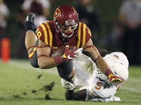 Iowa State wide receiver Trever Ryen is tackled by Texas defensive back Holton Hill, right, after making a reception during the first half of an NCAA college football game, Thursday, Sept. 28, 2017, in Ames, Iowa. (AP Photo/Charlie Neibergall)