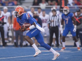 Boise State quarterback Montell Cozart (3) runs against Virginia during the first half of an NCAA college football, game Friday, Sept. 22, 2017, in Boise, Idaho. (Drew Nash/The Times-News via AP)