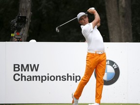 Rickie Fowler watches his tee shot on the second hole during the final round of the BMW Championship golf tournament at Conway Farms Golf Club, Sunday, Sept. 17, 2017, in Lake Forest, Ill. (AP Photo/Charles Rex Arbogast)