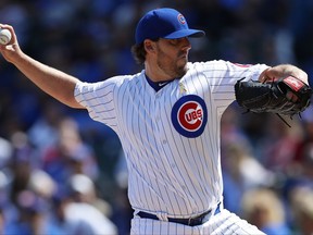 Chicago Cubs' John Lackey (41) pitches to the Atlanta Braves during the first inning of a baseball game Friday, Sept. 1, 2017, in Chicago. (AP Photo/Jim Young)