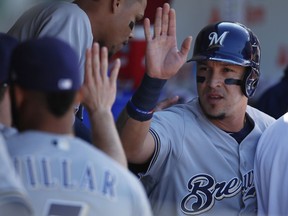 Milwaukee Brewers' Hernan Perez celebrates scoring a run against the Chicago Cubs during the third inning of a baseball game, Saturday, Sept. 9, 2017, in Chicago. (AP Photo/Jim Young)
