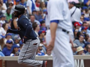 Atlanta Braves' Matt Kemp, left, rounds the bases after hitting a home run off Chicago Cubs' pitcher Jon Lester during the third inning of a baseball game Saturday, Sept. 2, 2017, in Chicago. (AP Photo/Jim Young)