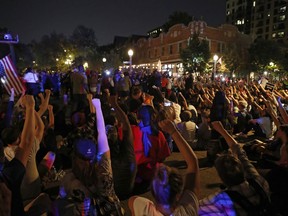 Protesters gather, Friday, Sept. 15, 2017, in St. Louis, after a judge found a white former St. Louis police officer, Jason Stockley, not guilty of first-degree murder in the death of a black man, Anthony Lamar Smith, who was fatally shot following a high-speed chase in 2011. (AP Photo/Jeff Roberson)