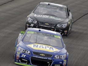 Chase Elliott (24) drives past Reed Sorenson (15) during a NASCAR Cup Monster Energy Series auto race at Chicagoland Speedway in Joliet, Ill., Sunday, Sept. 17, 2017. (AP Photo/Nam Y. Huh)