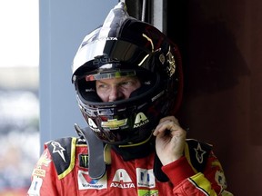 Dale Earnhardt Jr., looks around during the final practice for the NASCAR Cup Monster Energy Series auto race at Chicagoland Speedway in Joliet, Ill., Saturday, Sept. 16, 2017. (AP Photo/Nam Y. Huh)