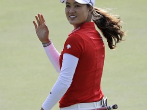 Minjee Lee, of Australia, smiles after making a birdie on the third hole during the final round of the Indy Women in Tech Championship golf tournament, Saturday, Sept. 9, 2017, in Indianapolis. (AP Photo/Darron Cummings)