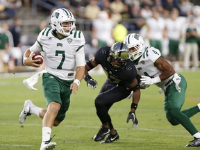 FILE - In this Friday, Sept. 8, 2017, file photo, Ohio quarterback Quinton Maxwell carries the ball against Purdue during the first half of an NCAA college football game in West Lafayette, Ind. Kansas rolls into Ohio University's Peden Stadium on Saturday having lost 41 straight road games. (John Terhune/Journal & Courier via AP, File)