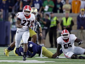 Georgia running back Nick Chubb (27) runs against Notre Dame during the first half of an NCAA college football game in South Bend, Ind., Saturday, Sept. 9, 2017. (AP Photo/Michael Conroy)