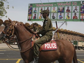 Pakistani police officers patrol in the vicinity of Gaddafi Stadium ahead of the World XI cricket series, in Lahore, Pakistan, Monday, Sept. 11, 2017. The series is aimed at reviving international cricket in Pakistan, since terrorists attacked the Sri Lanka cricket team bus in Lahore in 2009. (AP Photo/K.M. Chaudary)