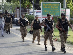 Pakistan army soldiers arrive at Gaddafi stadium ahead of a match between Pakistan and the World XI team, in Lahore, Pakistan, Wednesday, Sept. 13, 2017. World cricket governing body ICC wants international teams back in Pakistan after an eight-year absence due to security concerns but cautioned that it could be a "long process." (AP Photo/K.M. Chaudary)