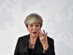 British Prime Minister Theresa May delivers her speech, in Florence, Italy, Friday Sept. 22, 2017. May will try Friday to revive foundering Brexit talks  and unify her fractious government  by proposing a two-year transition after Britain's departure from the European Union in 2019 during which the U.K. would continue to pay into the bloc's coffers.