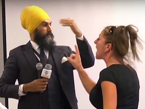 A woman confronts Jagmeet Singh at  a recent NDP leadership campaign event.