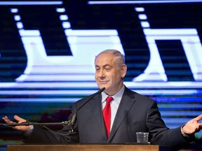 FILE -- In this Aug. 9, 2017 file photo, Israel's Prime Minister Benjamin Netanyahu speaks at his Likud Party conference, in Tel Aviv, Israel. With a slew of corruption scandals closing in on him, Netanyahu is increasingly dropping what remains of his statesmanlike persona in favor of nationalist rhetoric popular with his base. By cozying up to conservatives, anti-migrant voices and West Bank settlers, Netanyahu appears to be trying to reframe the corruption allegations as an ideological witch-hunt. (AP Photo/Oded Balilty, File)