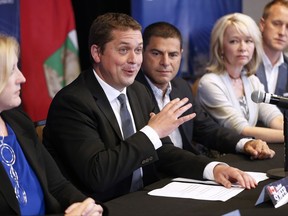 Conservative Party of Canada leader Andrew Scheer speaks, as Lisa Raitt, Alain Rayes, Candice Bergen and Chris Warkentin listen in, at his shadow cabinet meeting in Winnipeg, Wednesday, September 6, 2017. THE CANADIAN PRESS/John Woods