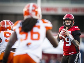 B.C. Lions' close in on Calgary Stampeders quarterback Bo Levi Mitchell during second half CFL football action in Calgary, Saturday, Sept. 16, 2017.THE CANADIAN PRESS/Jeff McIntosh