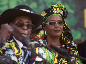 FILE -- In this Friday, Sept, 1, 2017 file photo, Zimbabwean First Lady Grace Mugabe, right, is seen with her husband Robert Mugabe at a rally in Gweru, Zimbabwe. Representatives of Zimbabwe's first lady say a young woman who accused her of assault was the actual aggressor, allegedly attacking her with a knife while drunk, according to a court document filed in South Africa, Tuesday, Sept. 12, 2017. (AP Photo/Tsvangirayi Mukwazhi, File)