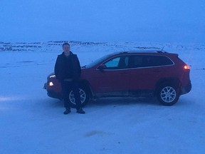 John Fawcett poses in front of his Jeep Cherokee.