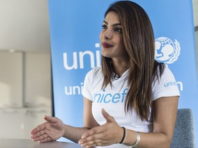Priyanka Chopra, a UNICEF Goodwill Ambassador, gives an interview to The Associated Press at the UNICEF Country Office in Amman, Jordan, Sunday, Sep. 10, 2017. Chopra said the world needs to do more to help those displaced by war -- through individual donations if governments won't step up. The Bollywood veteran who is increasingly making her mark in the U.S. also said Sunday that she didn't realize until working in America that it's "difficult for a woman of color" to be cast in a wide range of roles. (AP Photo/Lindsey Leger)