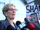 Premier Kathleen Wynne speaks to reporters after testifying at the Sudbury byelection trial on Sept. 13, 2017. 