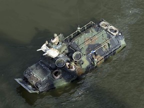 This Sept. 6, 2016, photo released by the U.S. Marine Corps shows Marines with the 2nd Amphibious Assault Battalion aboard AAV-7 Amphibious Assault Vehicles during an exercise on the Cumberland River in Nashville, Tenn. The Marine Corps said Wednesday, Sept. 13, 2017 that an AAV-7 similar to this one caught fire during a training exercise at Camp Pendleton, Calif., and15 Marines were taken to area hospitals, including several with serious injuries. (Lance Cpl. Jack A. E. Rigsby/U.S. Marine Corps via AP)