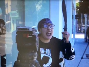 In this Thursday, Sept. 21, 2017, video image released by the Los Angeles County Sheriff's Department, actively searching for this suspect waving a machete at news reporters outside the Kardashian-owned DASH boutique in West Hollywood, Calif. KCBS-TV reported that after pointing a gun at employees inside the store, the woman returned and swung a machete at reporters and photographers outside the boutique before sticking it through a slot in the front door. (Los Angeles County Sheriff's Department via AP)