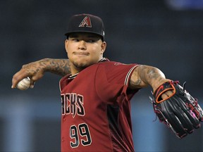 Arizona Diamondbacks starting pitcher Taijuan Walker winds up during the first inning of a baseball game against the Los Angeles Dodgers, Wednesday, Sept. 6, 2017, in Los Angeles. (AP Photo/Mark J. Terrill)