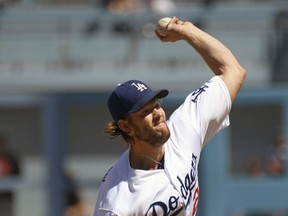Los Angeles Dodgers pitcher Clayton Kershaw throws to the plate during the first inning of a baseball game against the San Francisco Giants, Sunday, Sept. 24, 2017, in Los Angeles. (AP Photo/Michael Owen Baker)